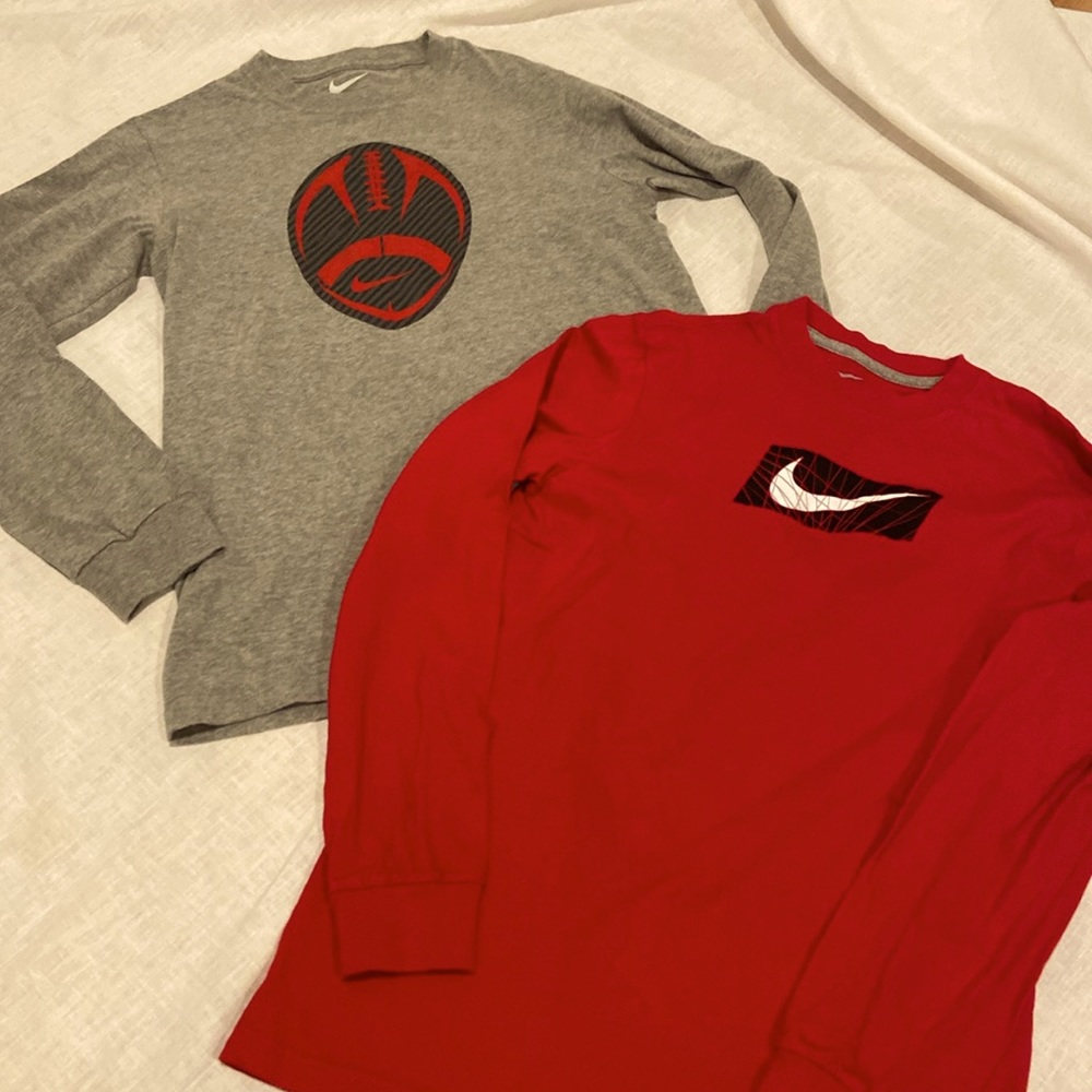 2 Nike tee shirts size large. One red with logo other grey with logo